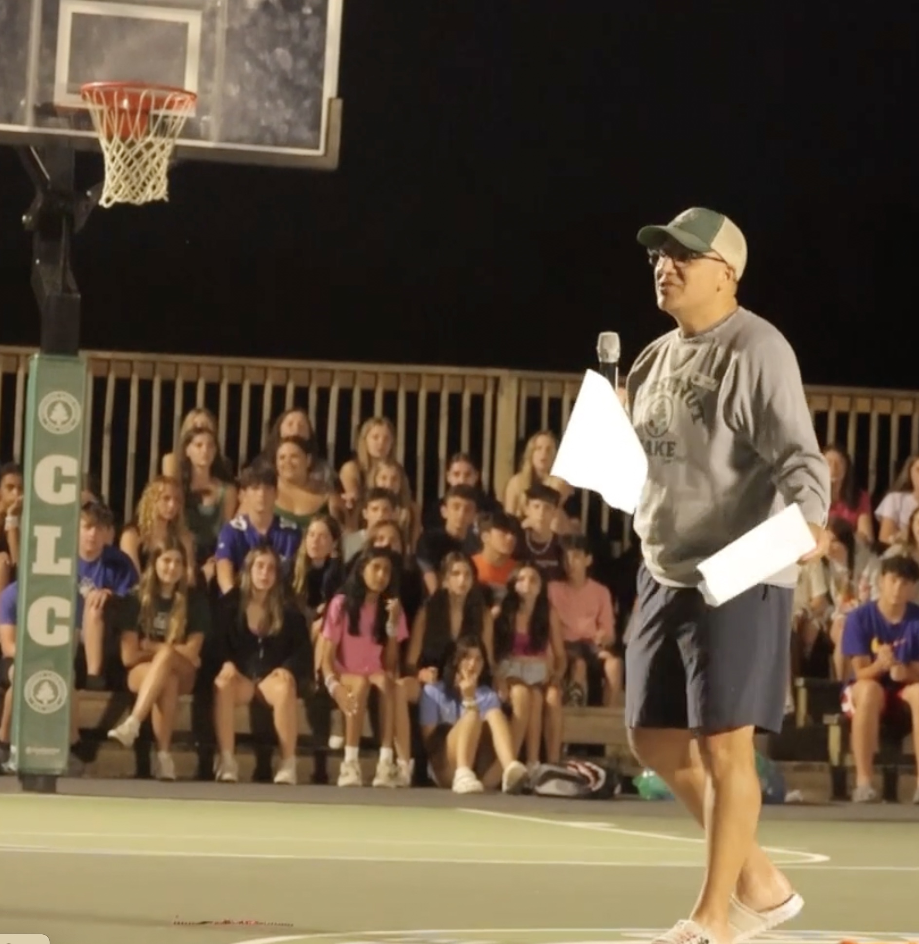 Campers and counselors gathered for a camp meeting, fostering teamwork, community spirit, and excitement for the day's adventures.