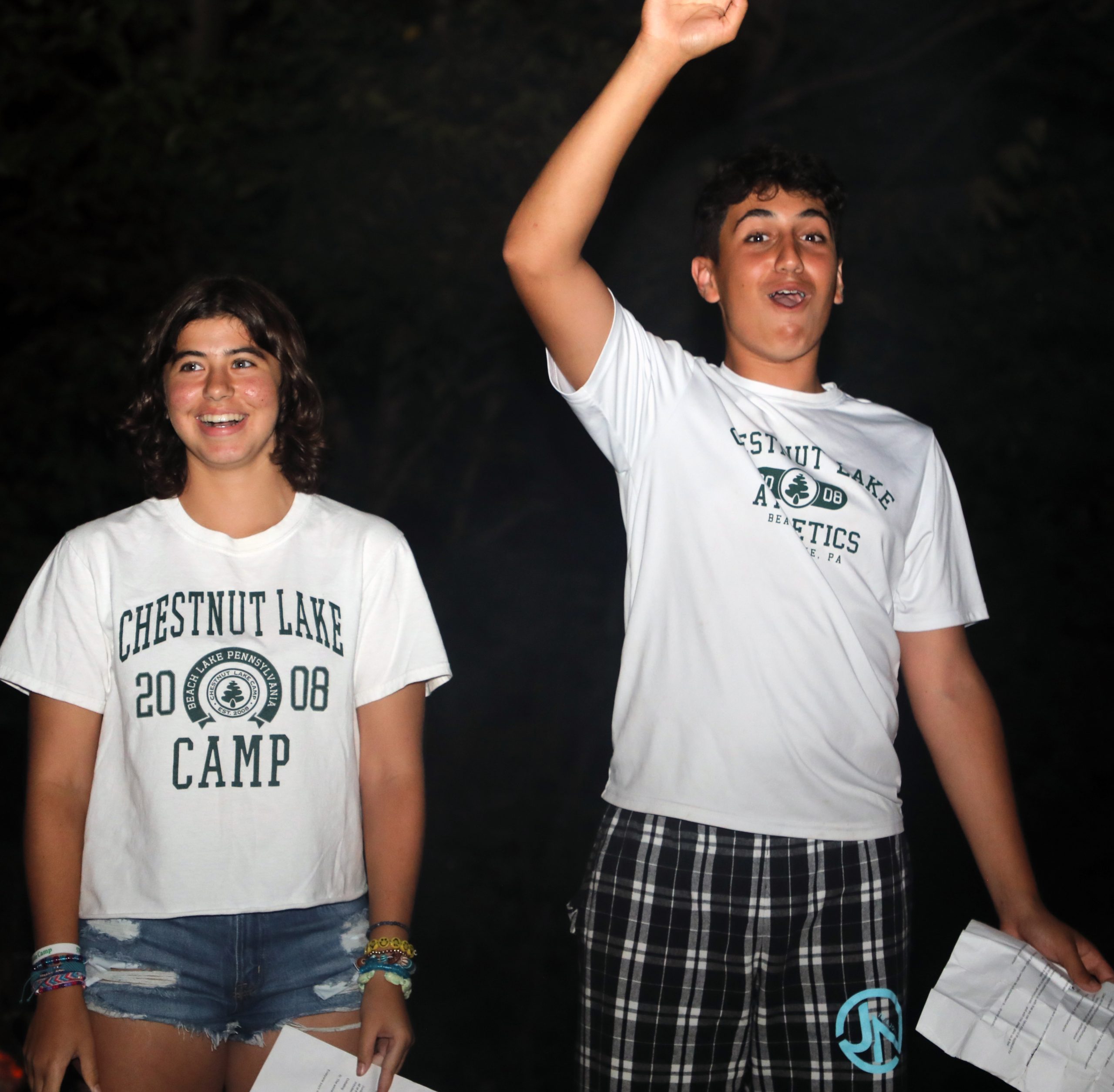 Two campers laughing and having fun, showcasing the joy, friendship, and unforgettable moments of summer camp.