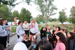 A group of campers gather for a meeting at Chestnut Lake camp.