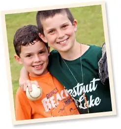 Campers playing baseball representing teamwork and values at Chestnut Lake Camp