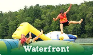 Waterfront video button showcasing lake activities at Chestnut Lake Camp in Beach Lake, PA